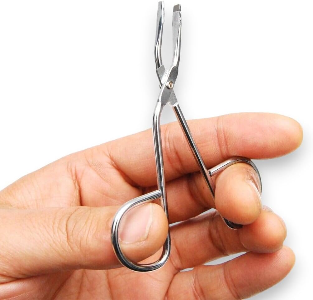 Hand demonstrating use of La Cross Scissors Tweezers, emphasizing ergonomic grip and control
