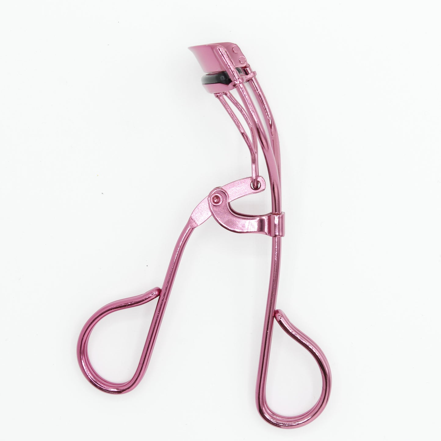 Folded La Cross eyelash curler demonstrating compact, portable design for travel and storage.