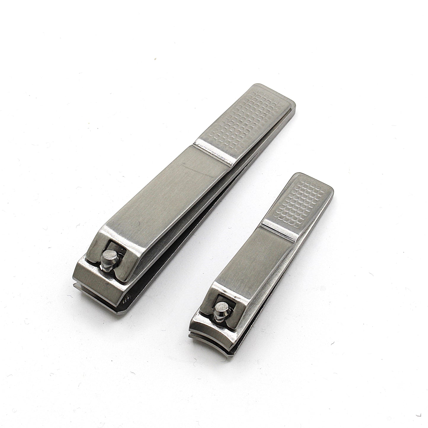 Two metallic nail clippers on a white background by La Cross