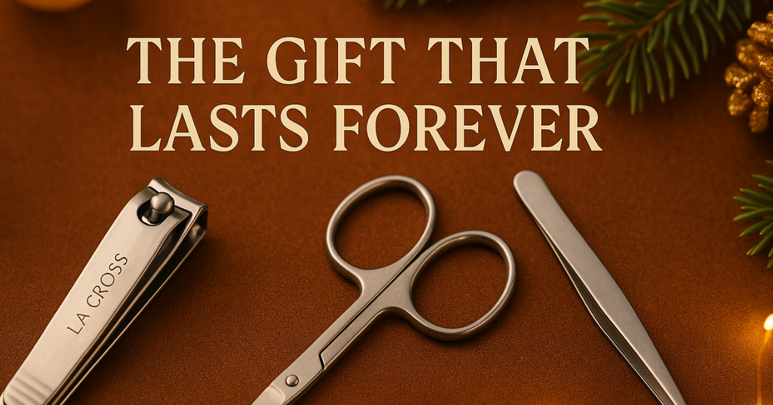 stainless steel nail clipper, scissors, and tweezer arranged on a festive brown surface with golden lights and pine branches, featuring the text “The Gift That Lasts Forever.