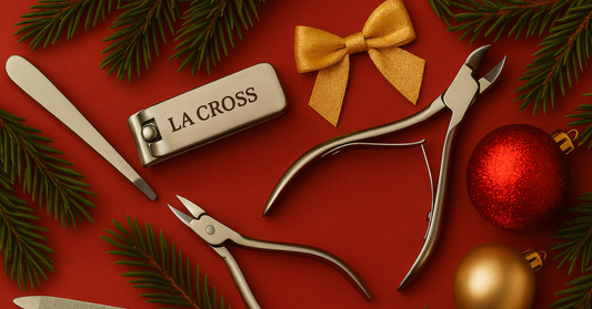 La Cross stainless steel grooming tools arranged on a red holiday background with ornaments and evergreen branches.