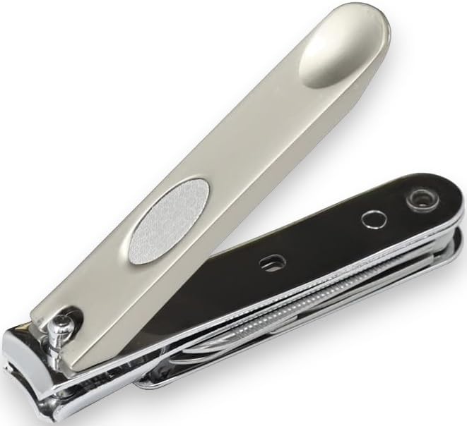 LA Cross Angled view of clipper showing file, scissor, and buffer attachments in use