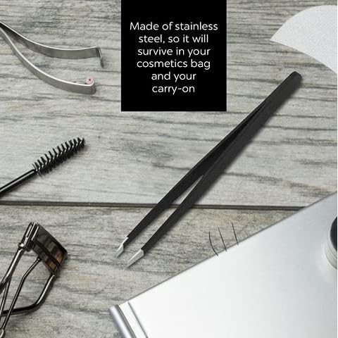 Close-up of La Cross Slant Tip Tweezer placed on vanity with beauty tools, showcasing compact and professional design