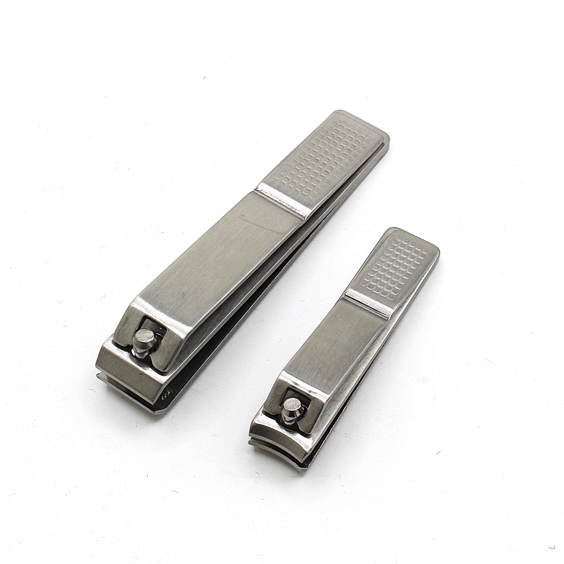 Two metallic nail clippers on a white background by La Cross
