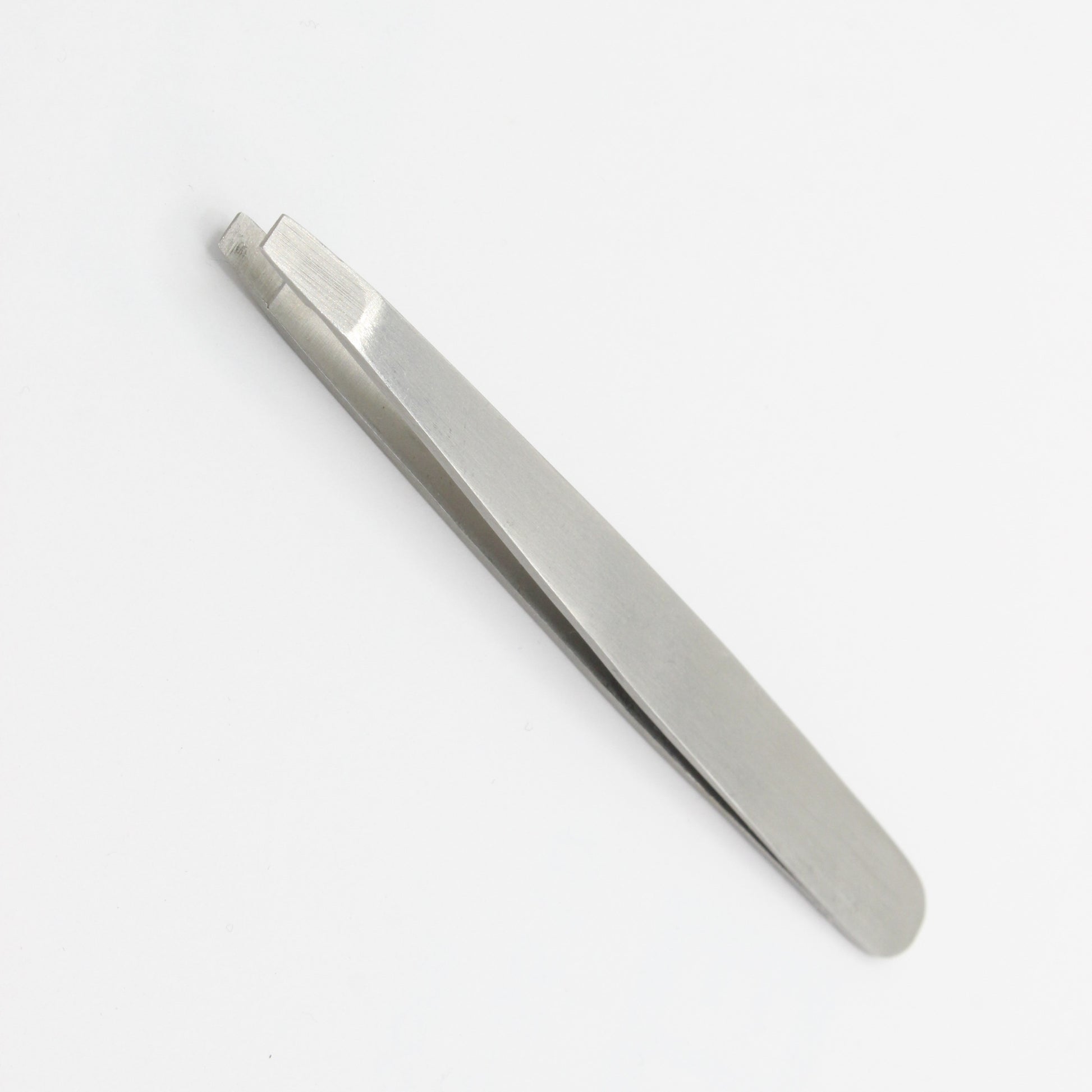 Silver straight tweezer for brow grooming and stray hair removal